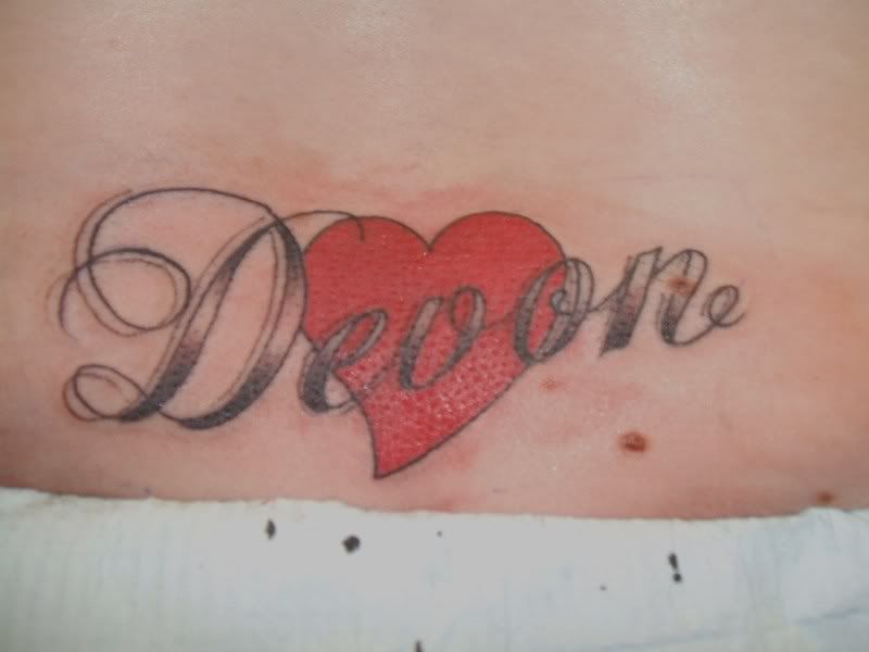I got what they call a "tramp stamp" haha with my sons name and my 