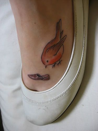 cute Beatrix Potter foot tattoo of a robin red-breast bird and a shoe.