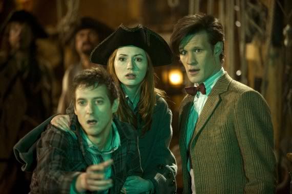 The Doctor, Amy and Rory watching the siren, with Amy trying to stop Rory from touching it in the Curse of the Black Spot